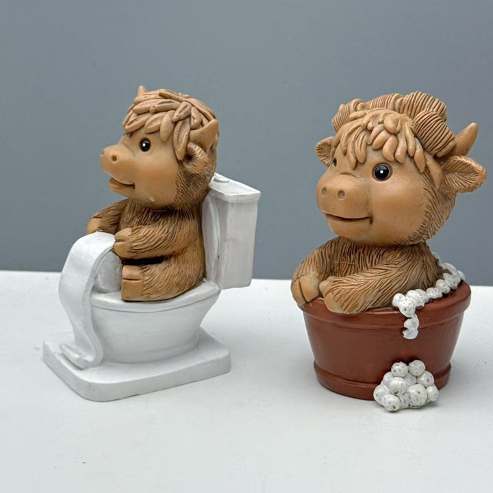 Funny decorative figure of a Highland cow on toilet Bowlift