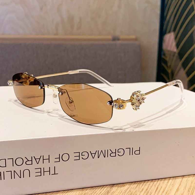 Fashionable sunglasses with luxurious golden accents Bowlift