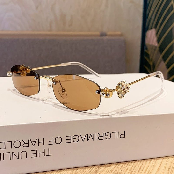 Fashionable sunglasses with luxurious golden accents Bowlift