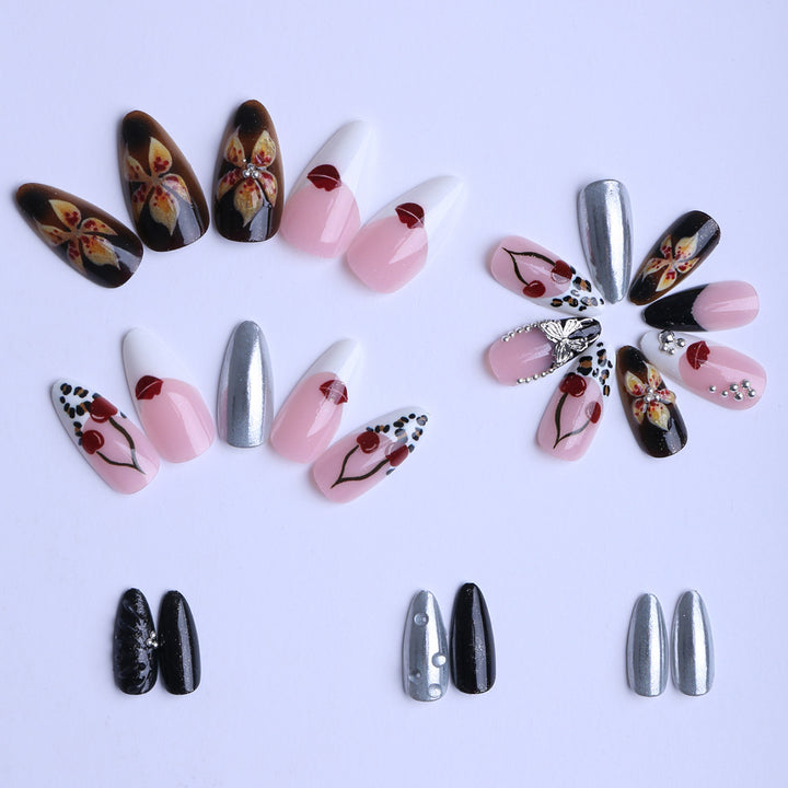 Artful Stiletto Fingernails with Unique Design Elements Bowlift