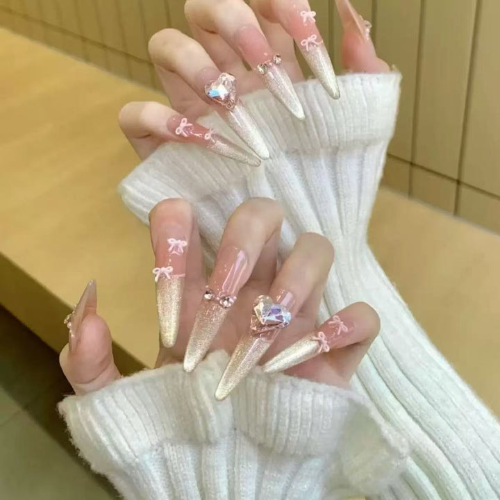 Acrylic nail set with elegant tips and glamorous rhinestone accents Bowlift