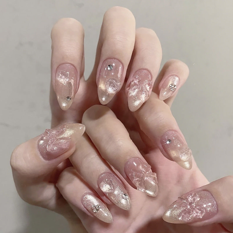 Artful stiletto nails with floral design and glitter accents Bowlift