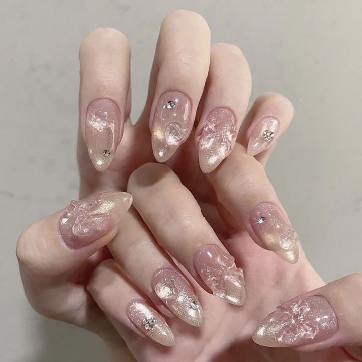 Artful stiletto nails with floral design and glitter accents Bowlift