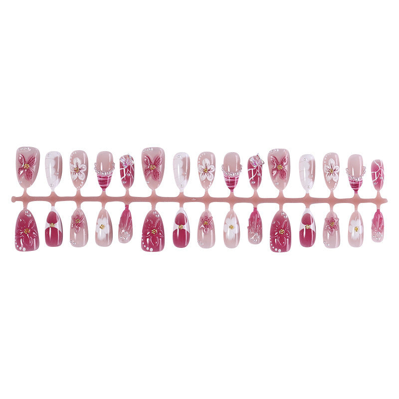 Creative acrylic nail set with floral accents and glitter decorations Bowlift