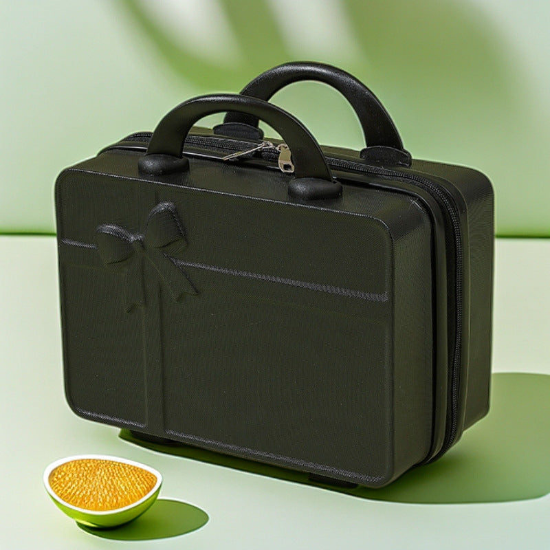 structured hard-shell cosmetic travel case with embossed bow and dual top handles Bowlift