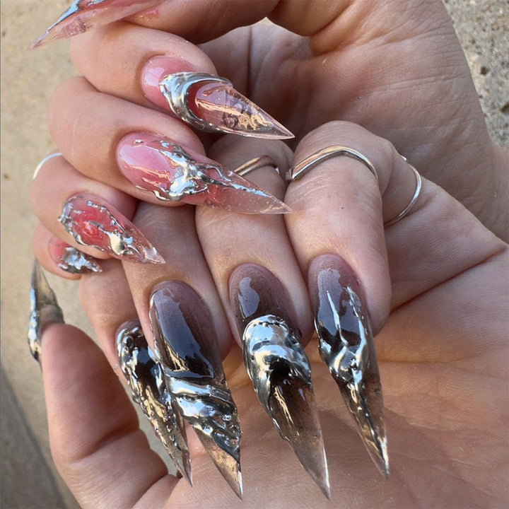 Creative stiletto nails with unique metallic details Bowlift