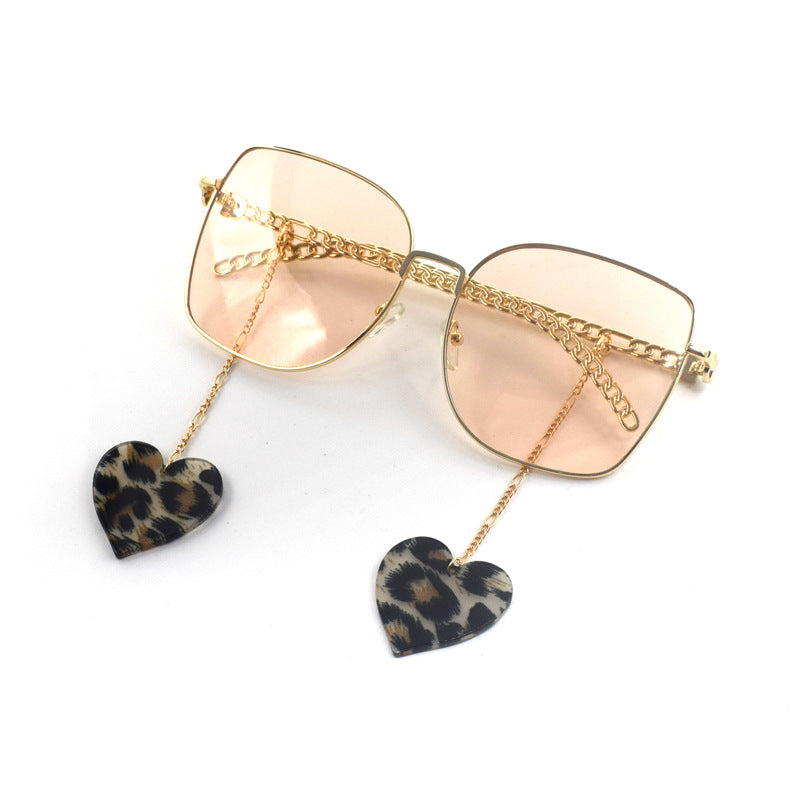 Heart-Shaped Dangle Earrings with Golden Chain Bowlift