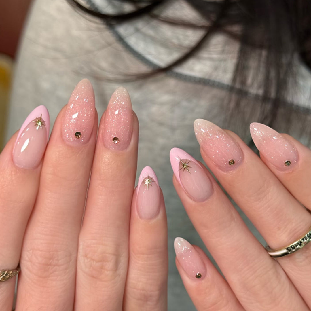 Artistic nail design with glitter and star accents Bowlift