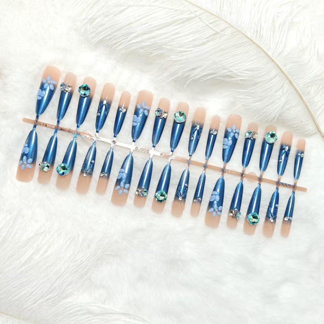 Elegant artificial nails with floral applications and glitter elements Bowlift