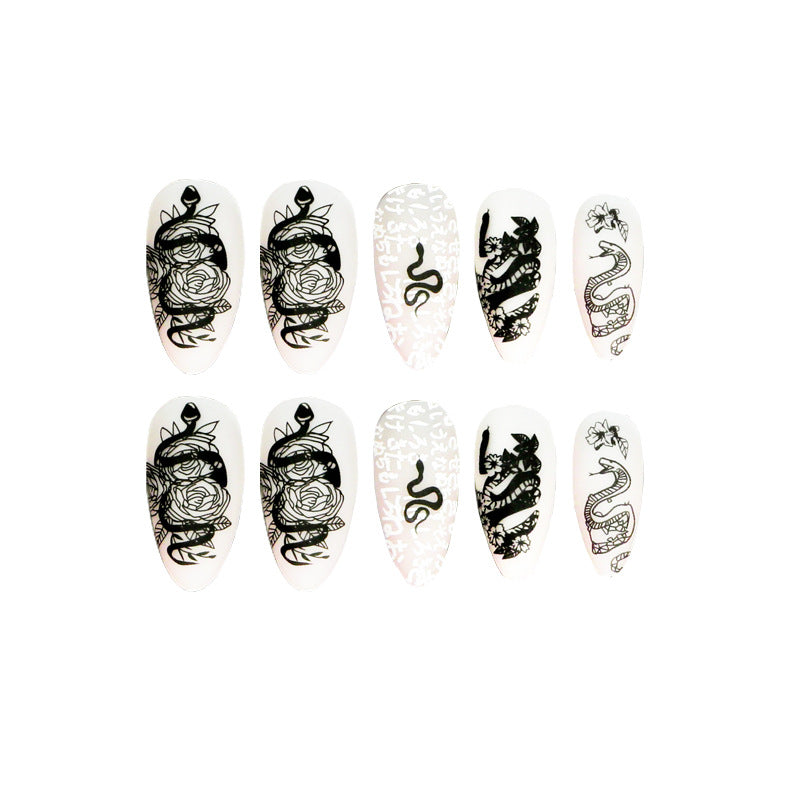 Artful nail extensions in elegant stiletto style with artistic floral and graphic designs Bowlift