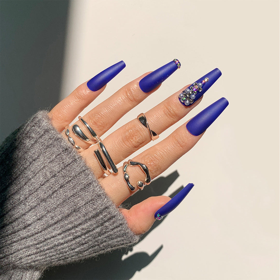 Nail extensions with elegant rhinestone embellishments Bowlift
