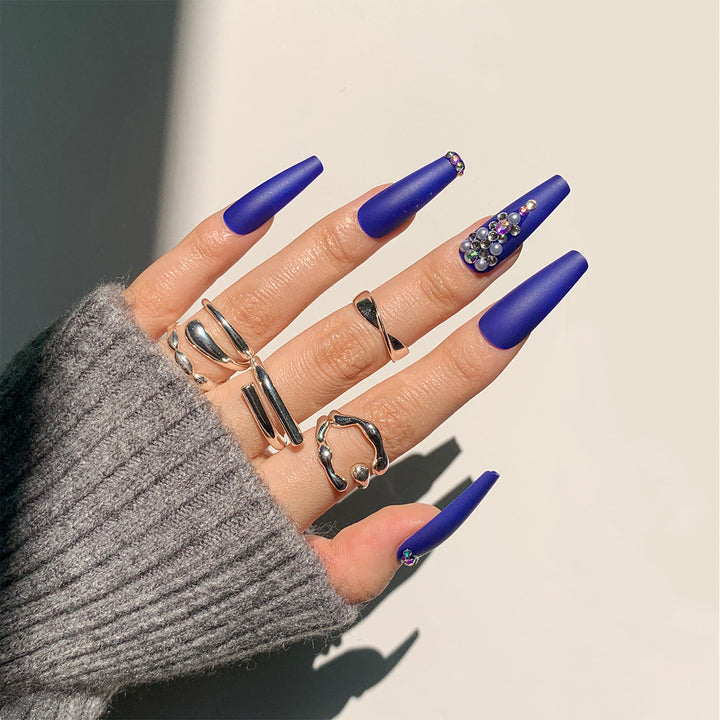 Nail extensions with elegant rhinestone embellishments Bowlift
