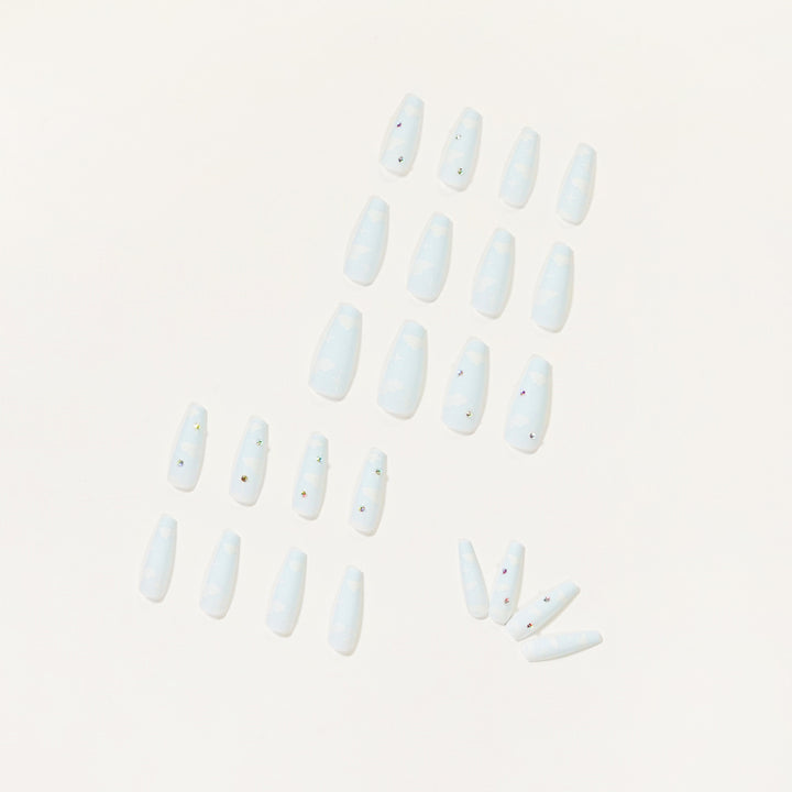 Creative nail art in cloud design with glitter accents Bowlift