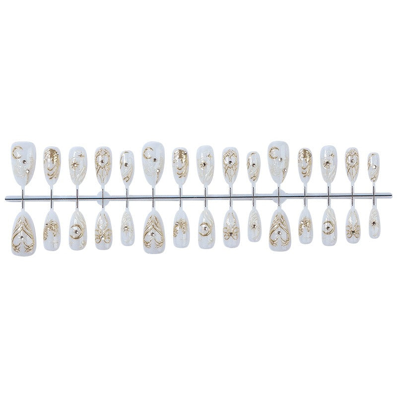 Acrylic nail set with elegant embellishments and glitter accents Bowlift