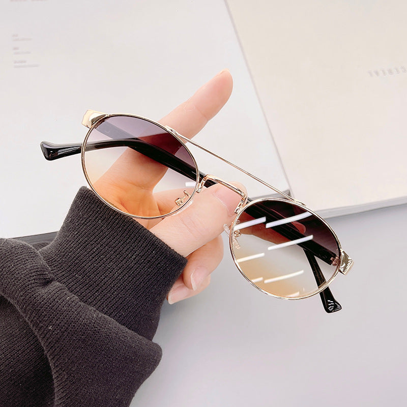 Ladies fashionable sunglasses in stylish round design with golden accents Bowlift