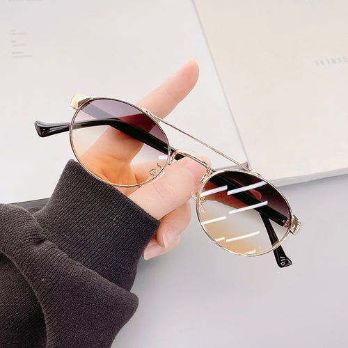 Ladies fashionable sunglasses in stylish round design with golden accents Bowlift