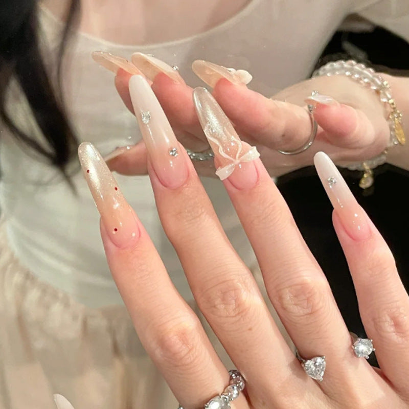 Elegant Stiletto Press-On Nails with Decorative Bow and Rhinestone Accents Bowlift