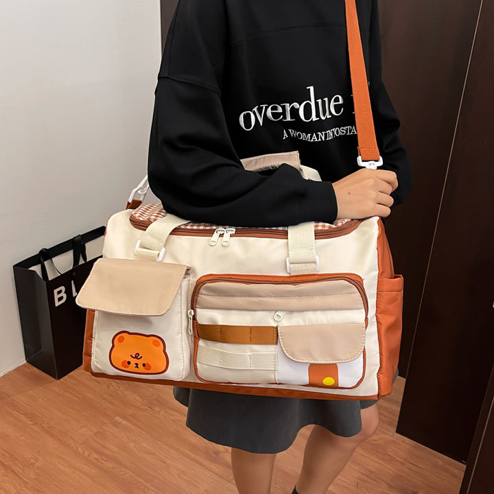 Sporty travel bag with multiple outer pockets Bowlift
