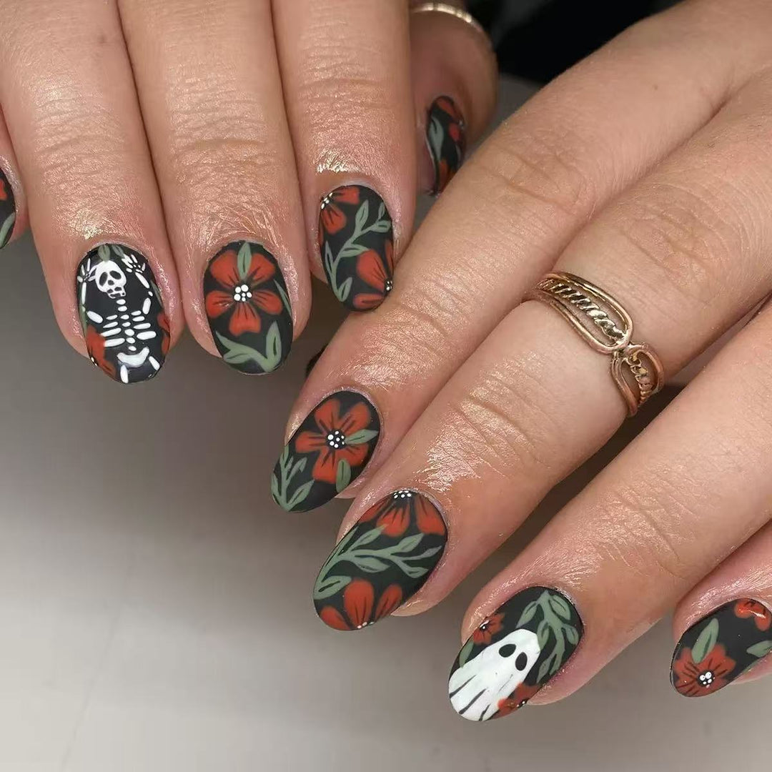 Acrylic nail set with creepy Halloween designs and floral accents Bowlift