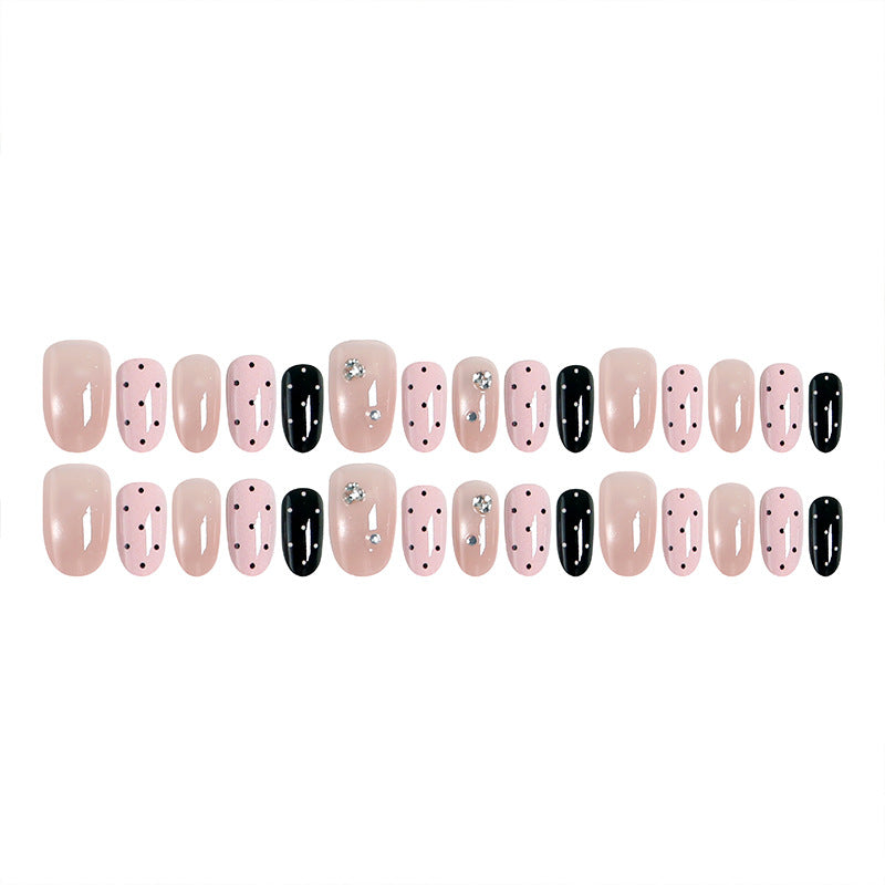 Acrylic nail set with glamorous rhinestone accents and modern dots Bowlift