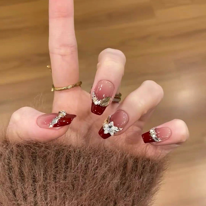 Artistic Press-On Nail Design with Gemstone Accents Bowlift