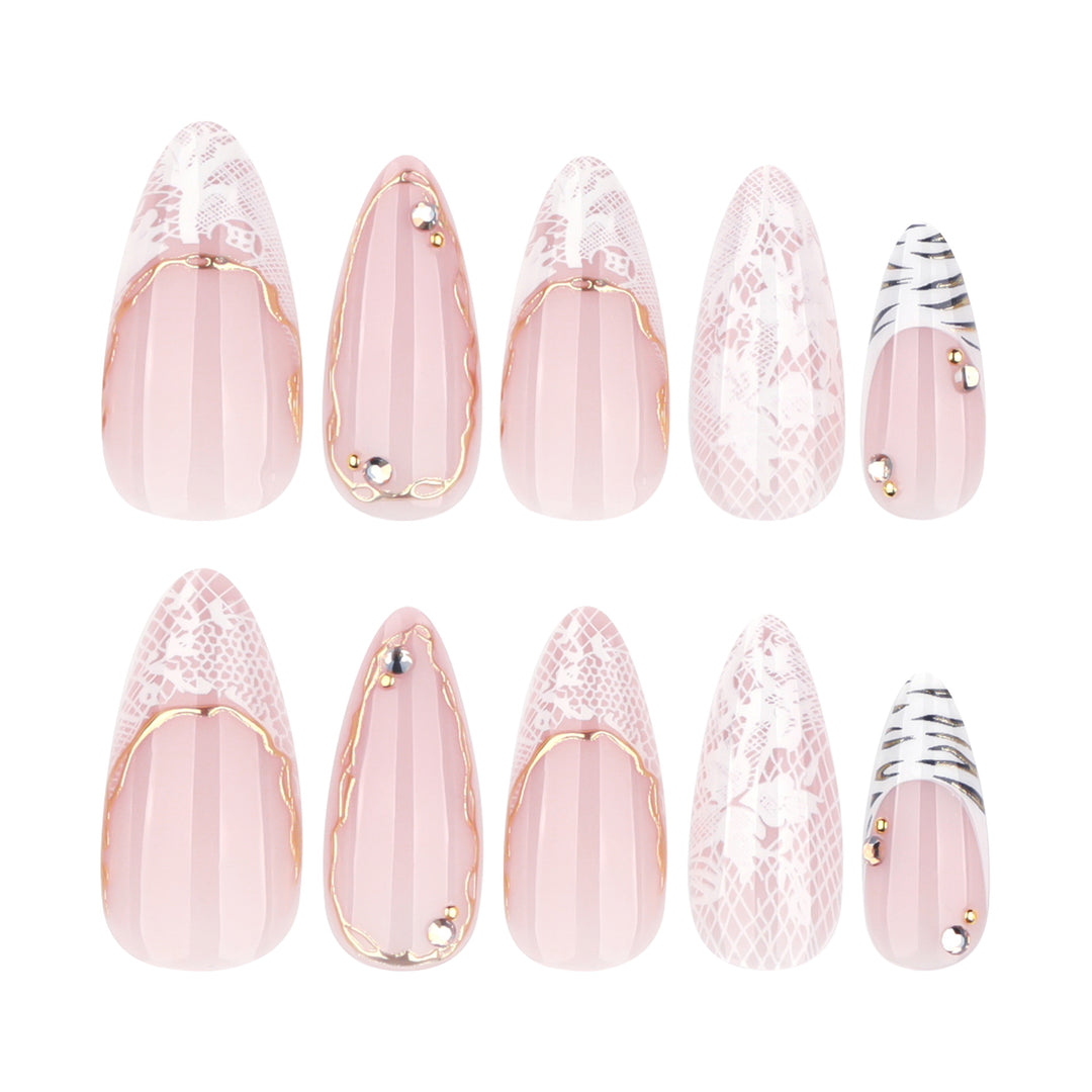Artful stiletto nails with gold and tip embellishments Bowlift