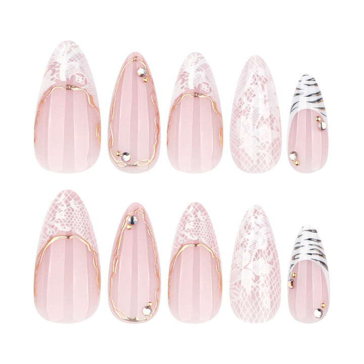 Artful stiletto nails with gold and tip embellishments Bowlift