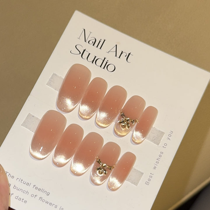 Artificial nails with elegant tip design and gold accents Bowlift