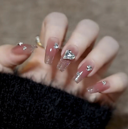 Artistic Nail Art with Glitter and Flower Applications Bowlift
