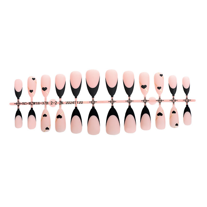 Creative nail art set with heart-shaped accents and elegant French tips Bowlift