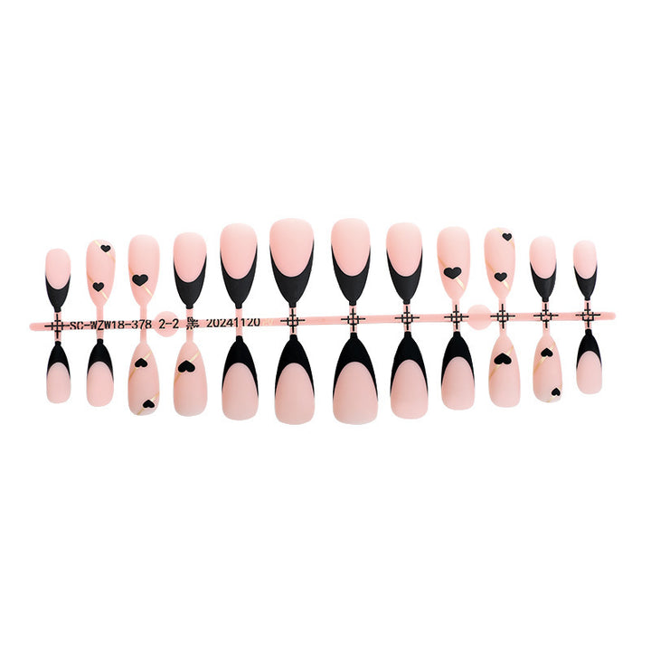 Creative nail art set with heart-shaped accents and elegant French tips Bowlift