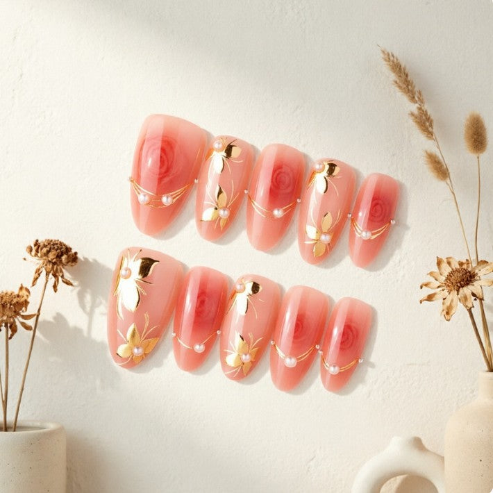 Artistic Nail Tips with Elegant Gold Jewelry Bowlift
