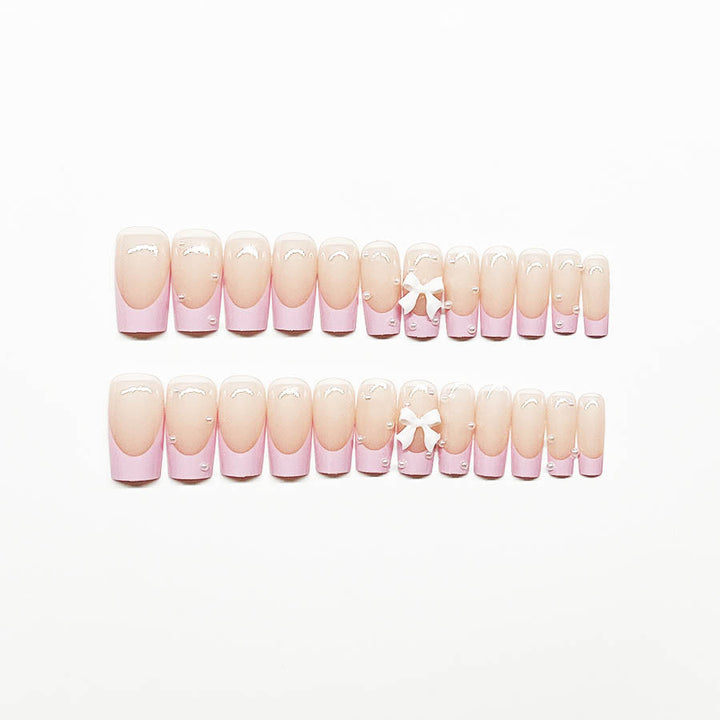 Artificial nail set with romantic bow and pearl embellishments Bowlift