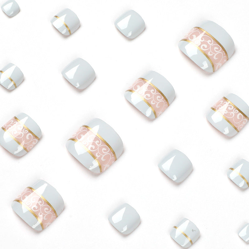 Artful toenail art with elegant golden accents Bowlift