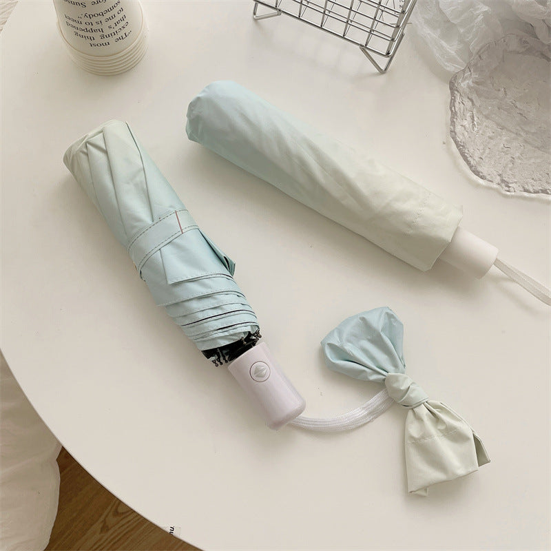 Women Folding Umbrella Bowlift