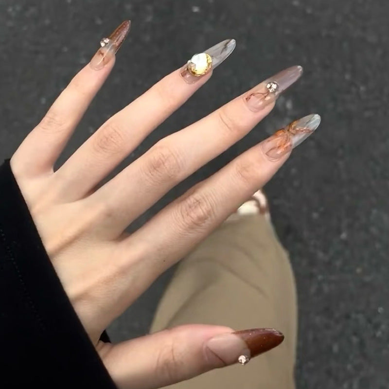 Glamorous artificial nails with creative embellishments Bowlift