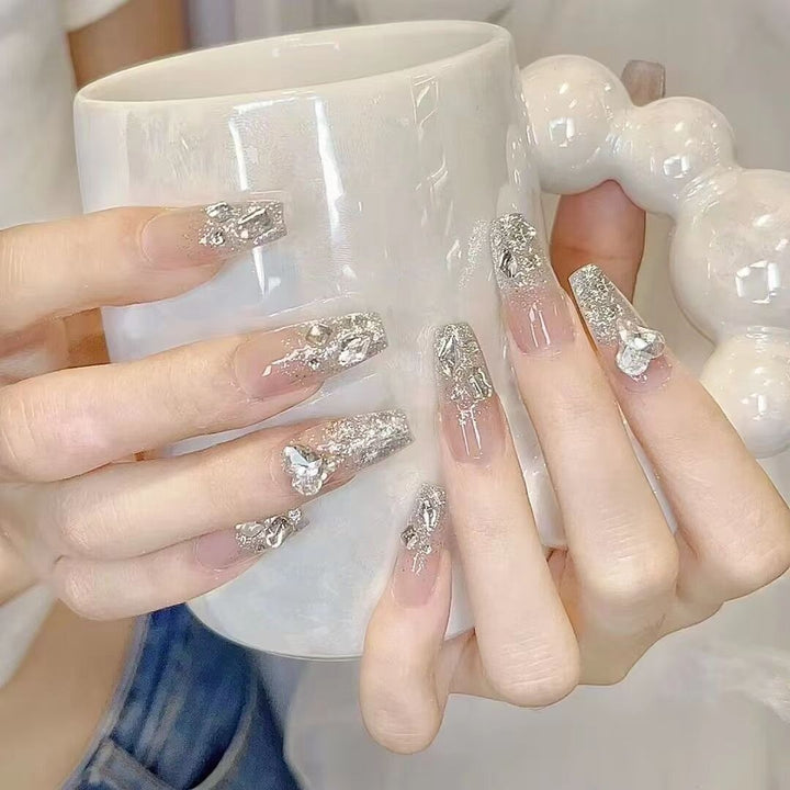 Elegant Nail Art with Glitter and Rhinestones Bowlift