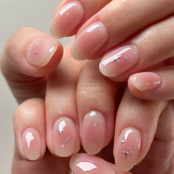 Elegant Glossy Nail Tips with Subtle Star Accents Bowlift