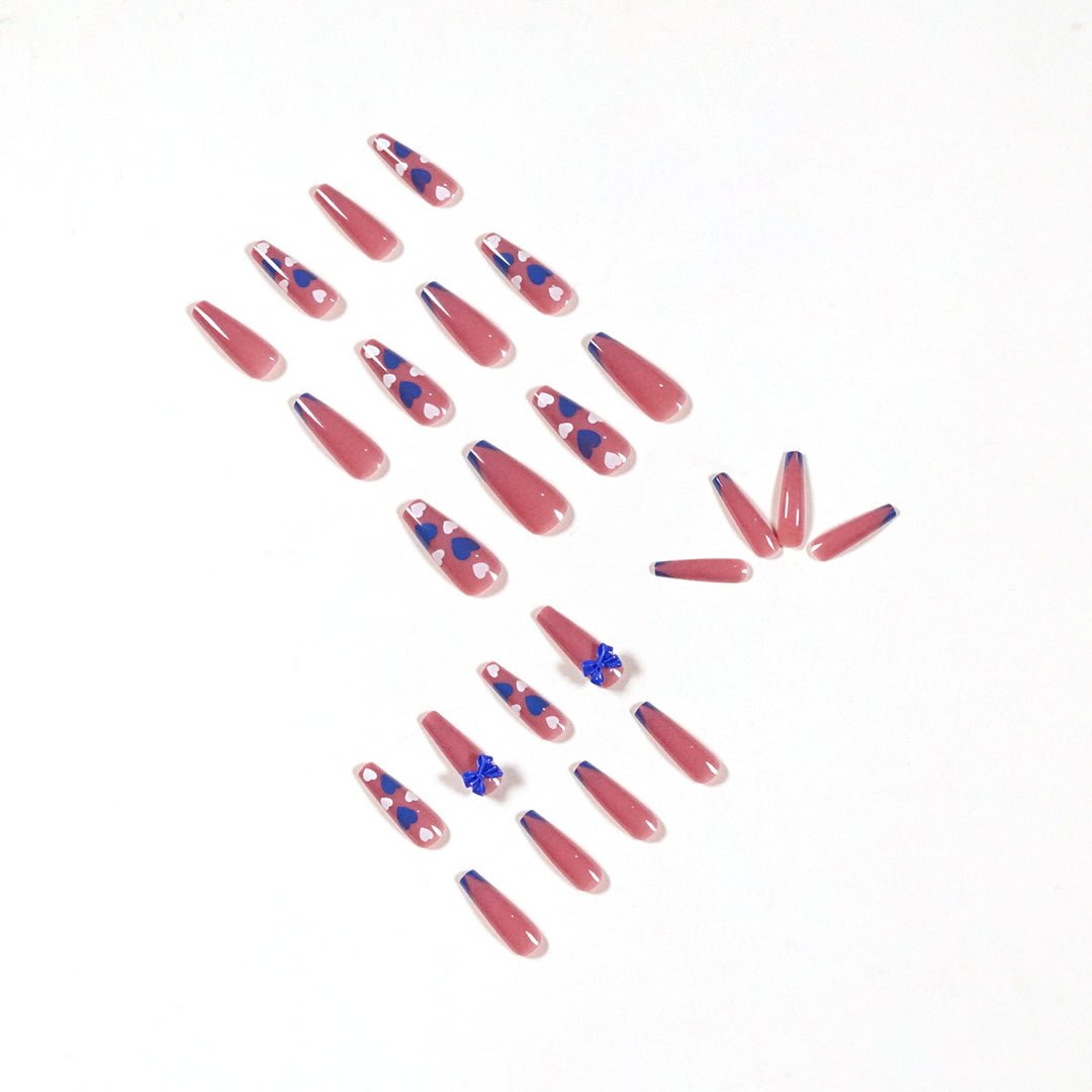Artful stiletto nails with modern heart and bow motifs Bowlift
