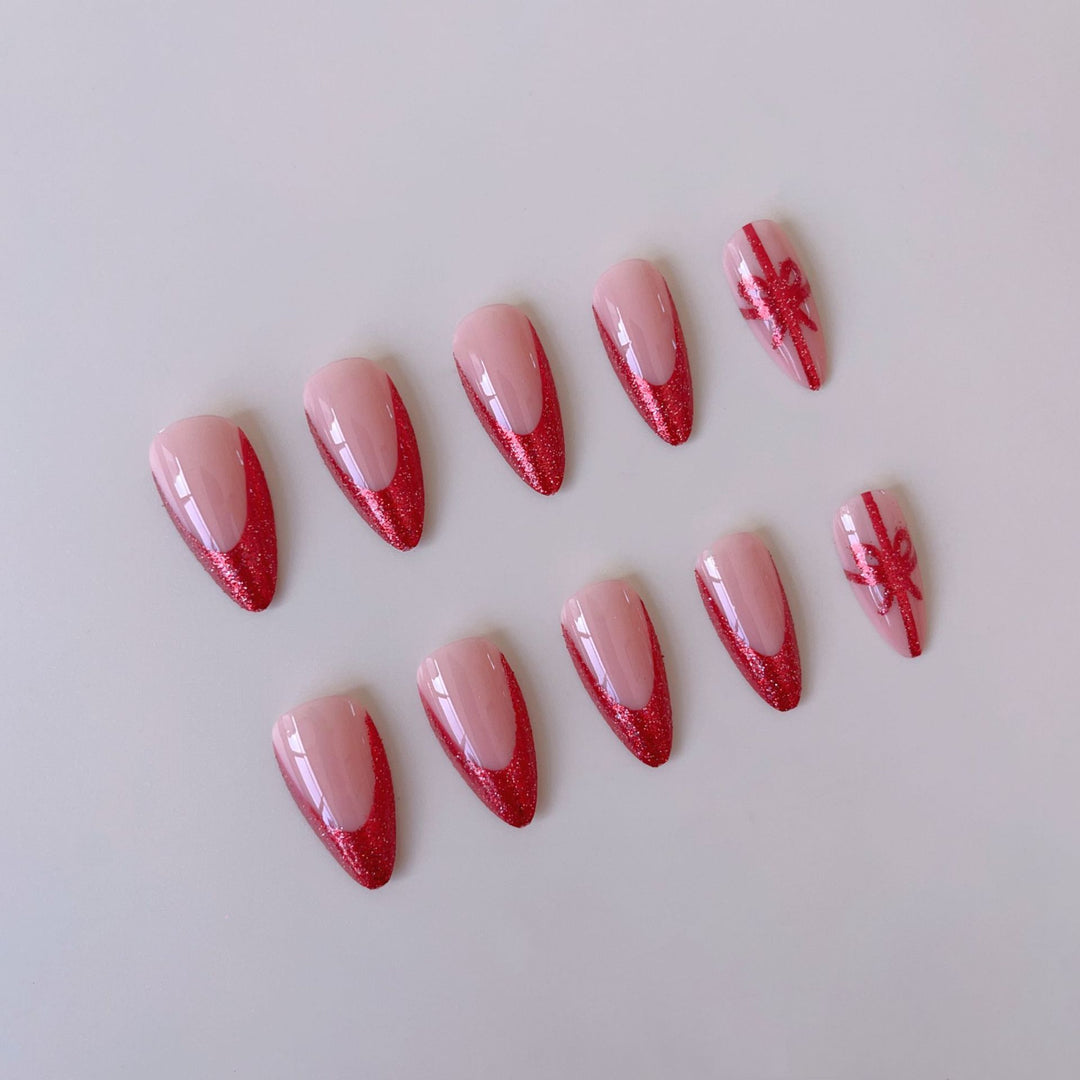 Nail set with glamorous glitter accents and bow design Bowlift