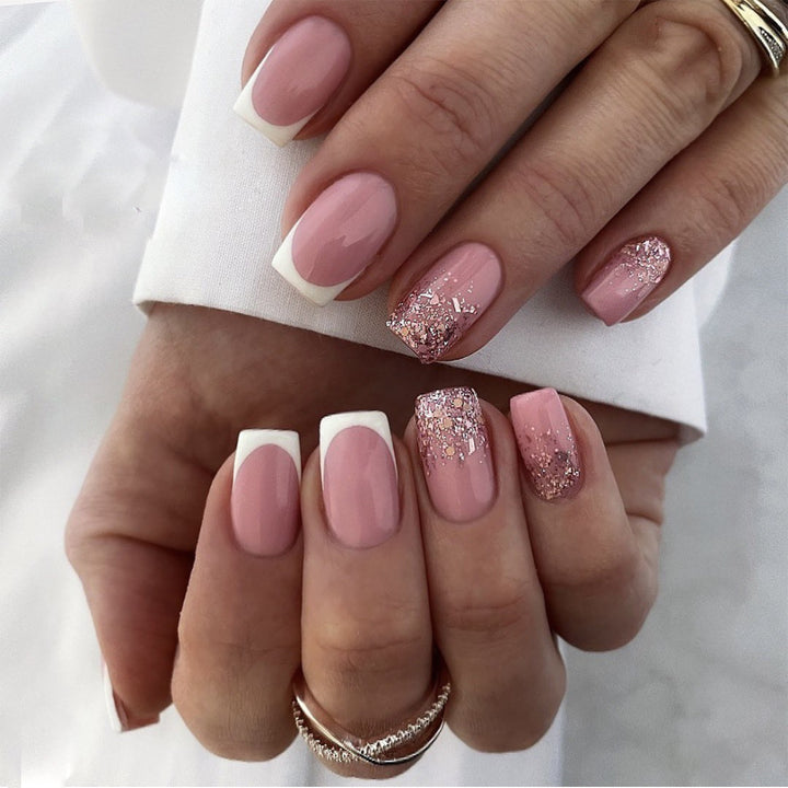 Artful Nail Art with Elegant Glitter and French Tip Accents Bowlift