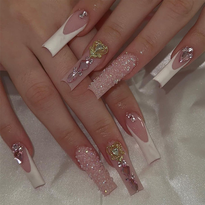 Glamorous artificial nail set with sparkling rhinestones and cross decorations Bowlift