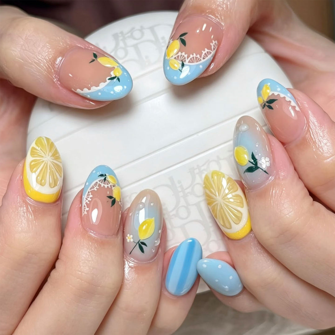 Artificial nail art with lemon and flower motifs Bowlift