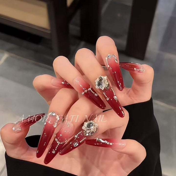 Acrylic nail set with elegant tips and glamorous rhinestone accents Bowlift