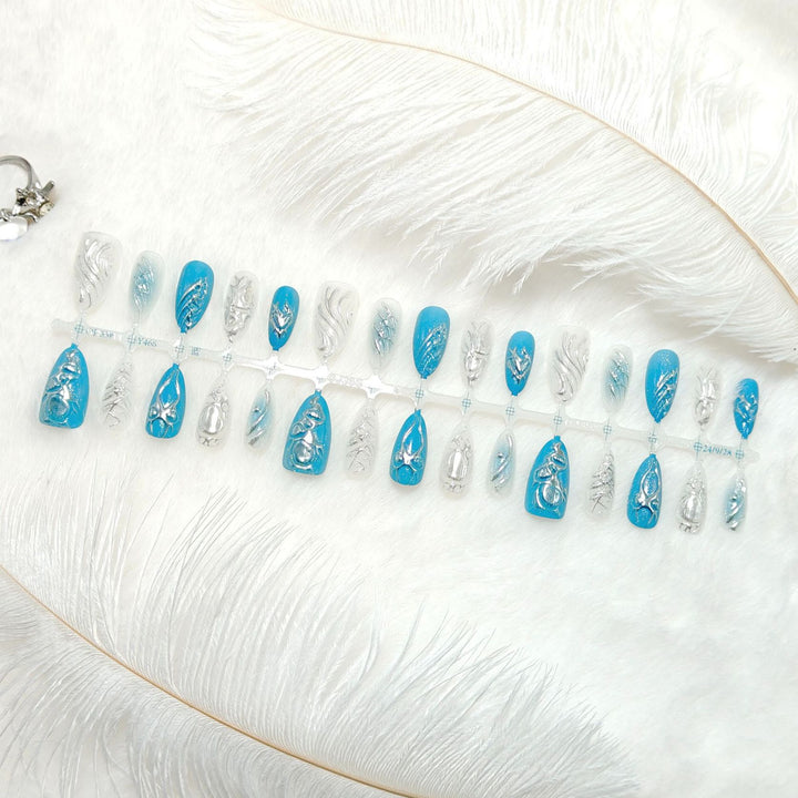 Creative artificial nails with shiny silver and turquoise tones Bowlift