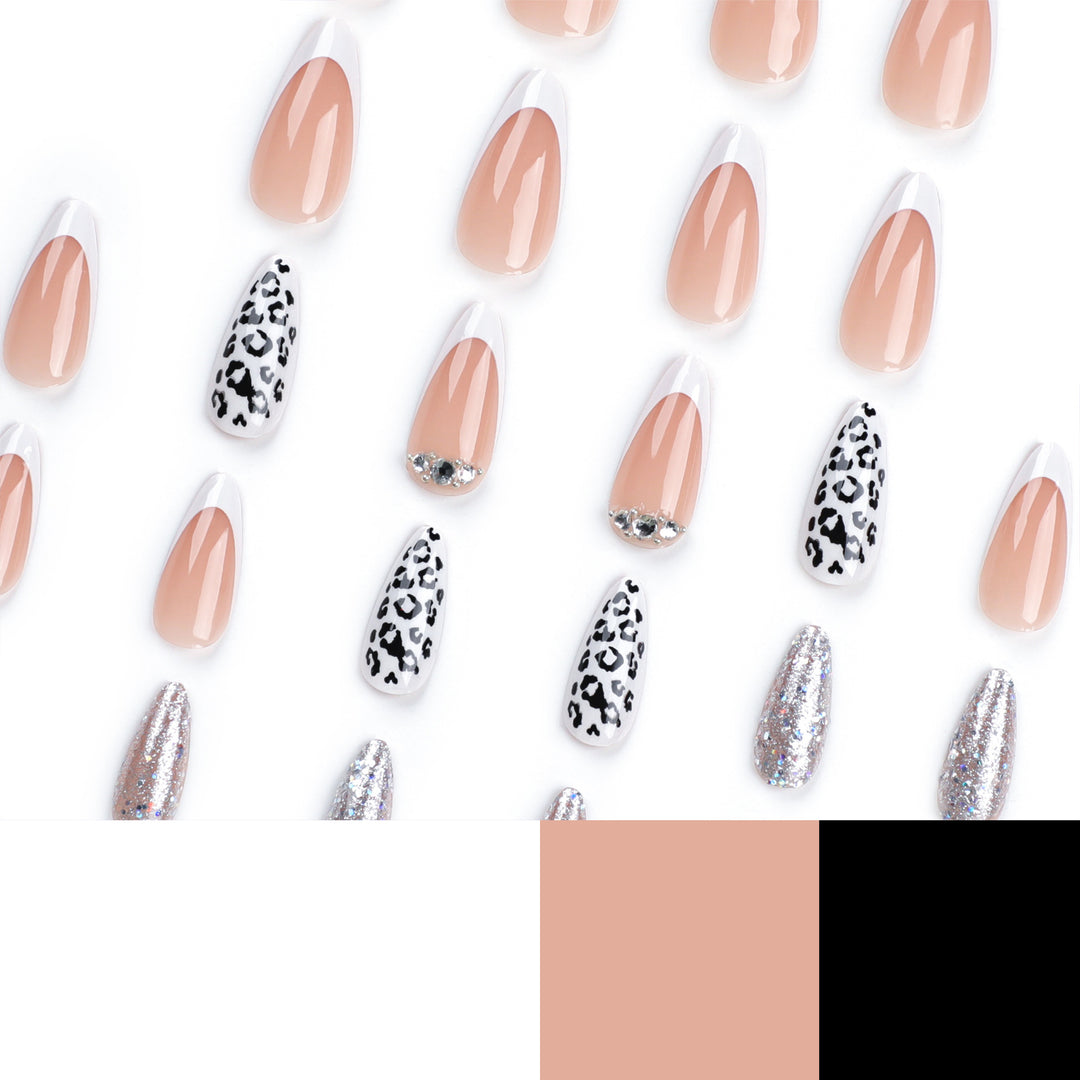 Artful stiletto nails with leopard patterns and glitter accents Bowlift