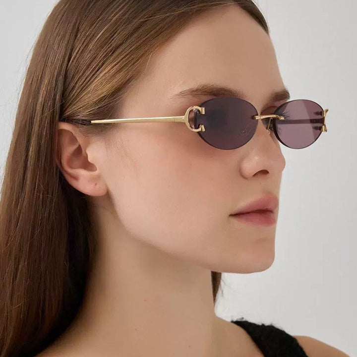 Women's elegant oval-shaped sunglasses with fashionable metal frame Bowlift