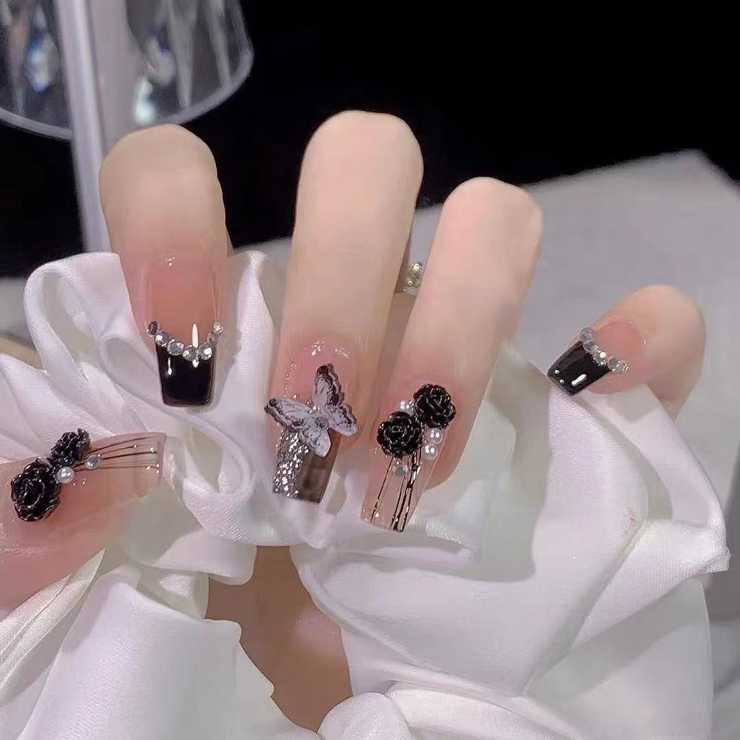 Elegant nail design with bow and rhinestone details Bowlift
