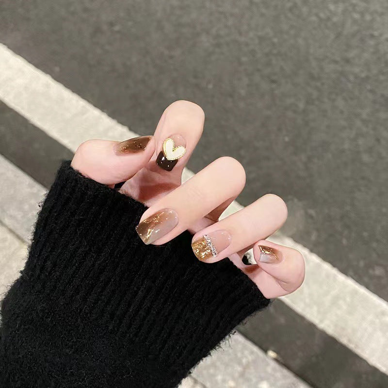 Artistic Nail Extensions with Heart and Glitter Accents Bowlift