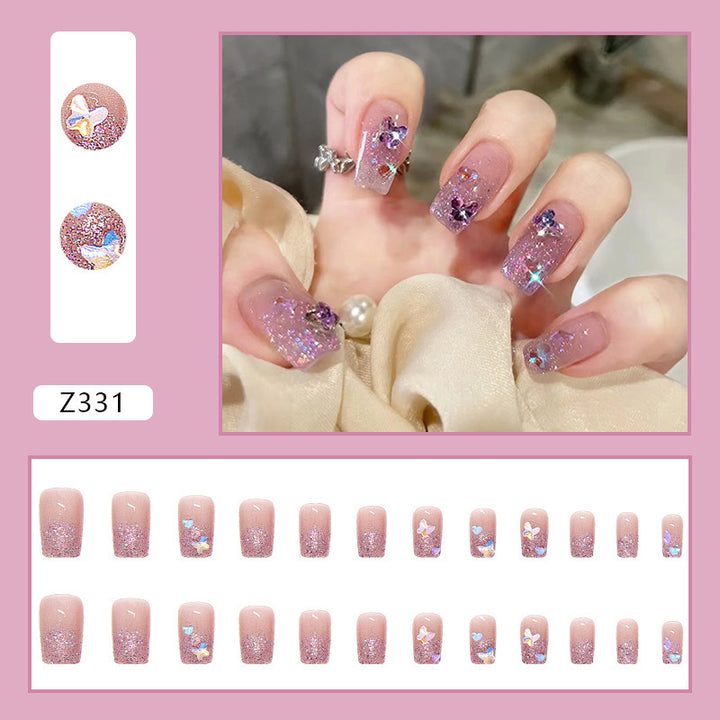 Glamorous artificial nails with glitter and floral accents Bowlift